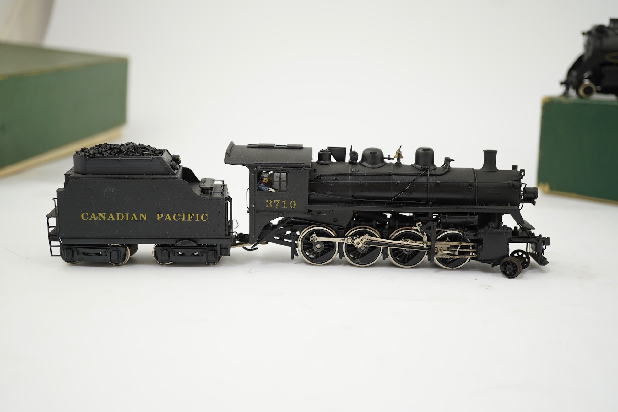 Two boxed HO gauge Canadian Pacific locomotives; a Toby of Japan model of 2412, 4-6-2 locomotive with bogie tender, together with a United Scale Models 3710, 2-8-0 locomotive with bogie tender, both powered for two rail